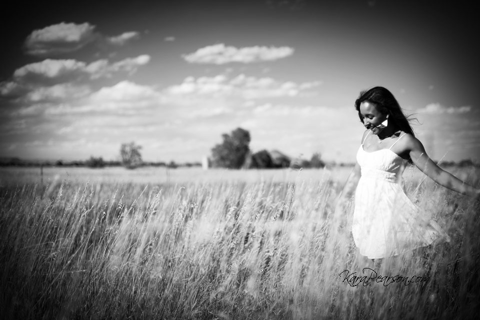 senior portrait in a field