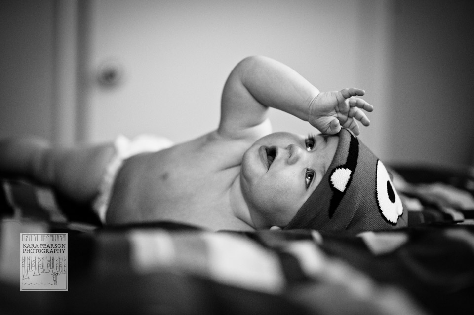 baby playing with hat