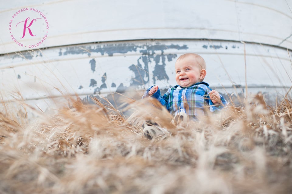 baby playing in field