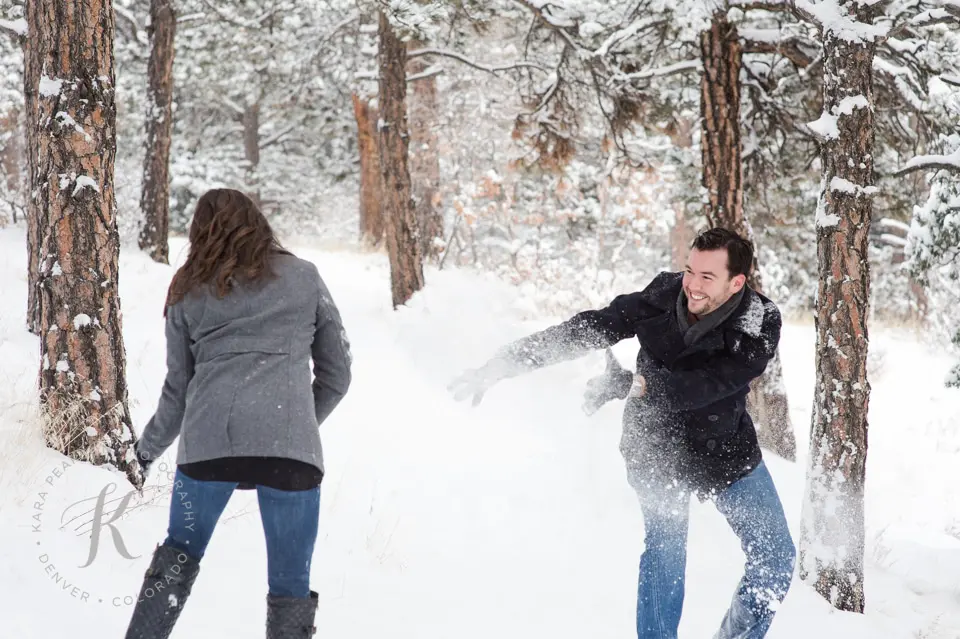 snowball fight during engagement session
