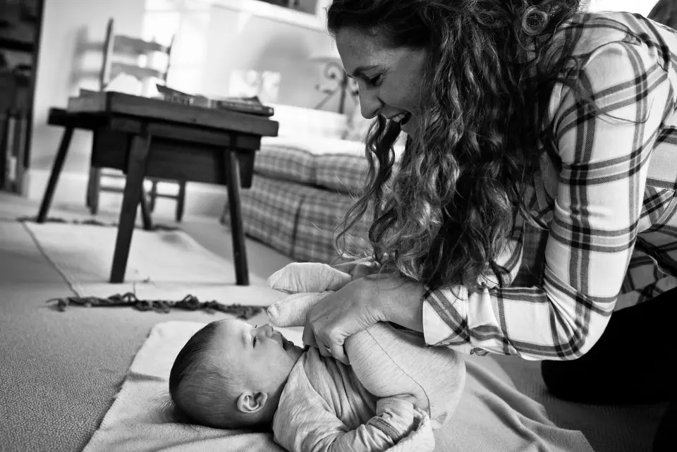 mom plays with baby