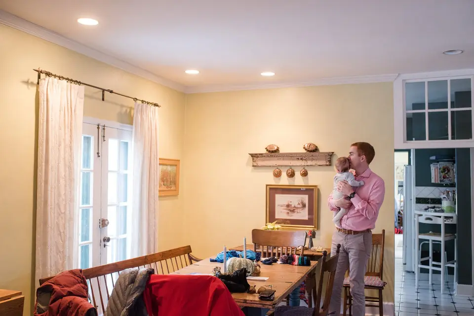 dad holds baby