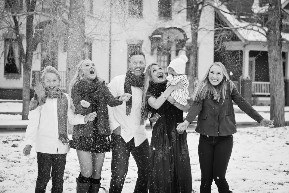 family portraits throwing snow in the air
