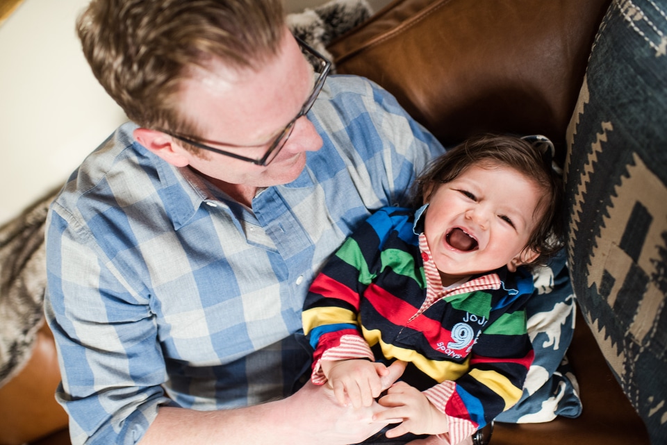 dad laughs with son