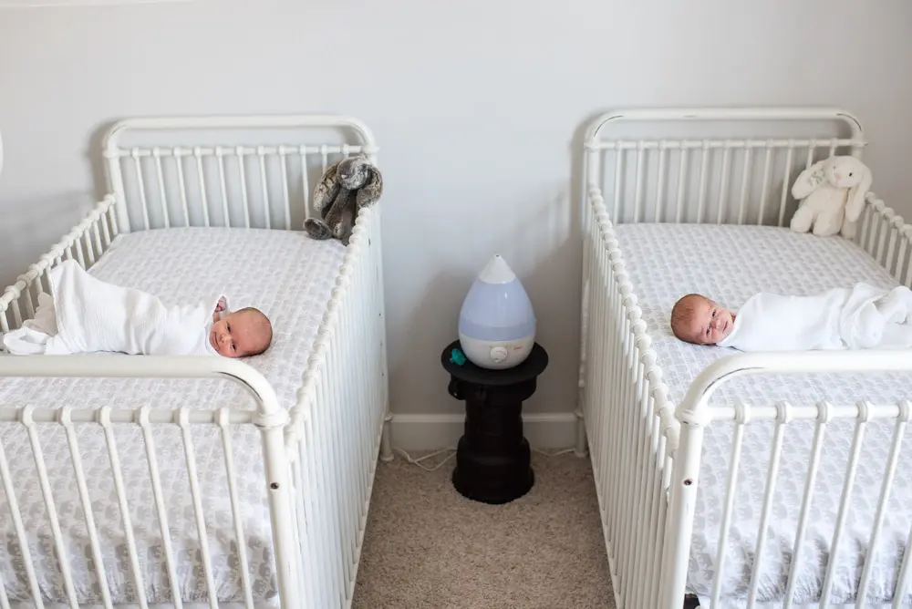 twins in cribs