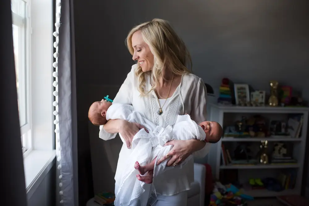 mom holding newborn twins