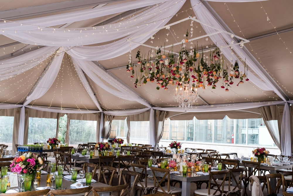 flowers hanging from tent ceiling