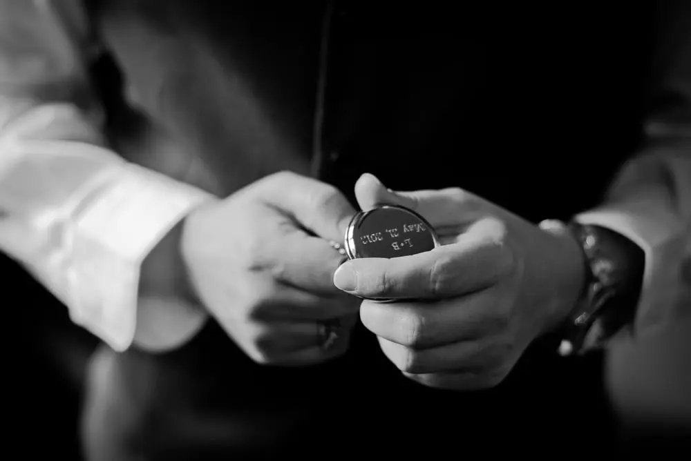 groom carries pocketwatch
