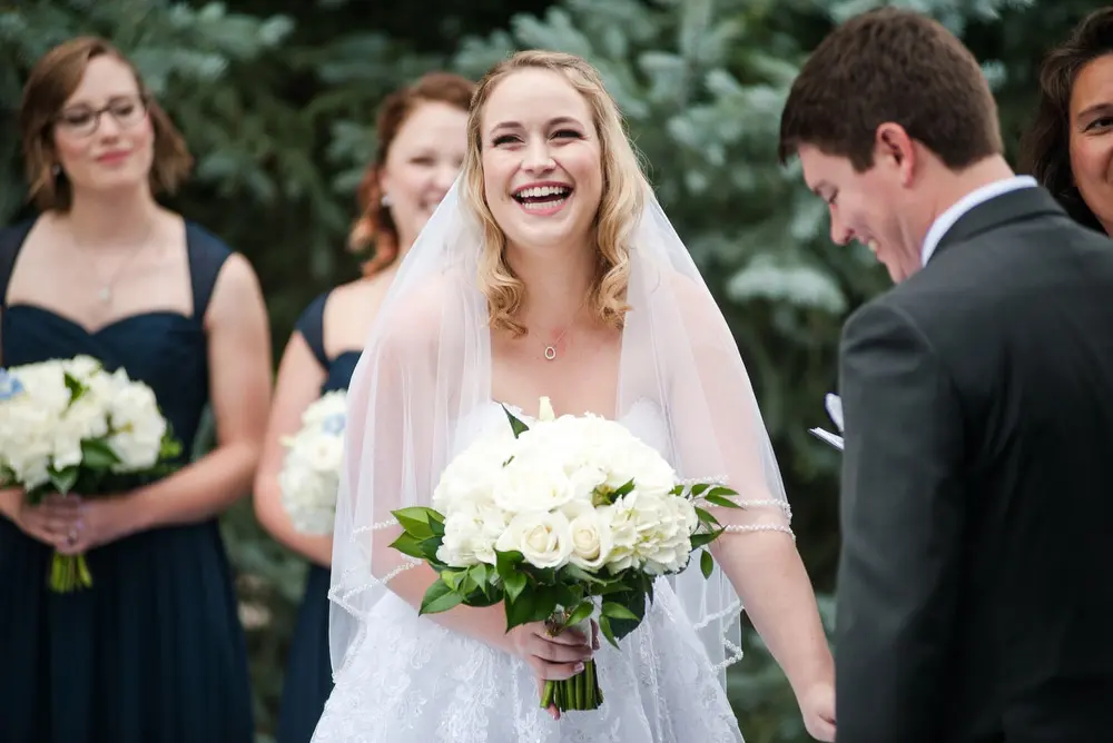 bride laughing at wedding