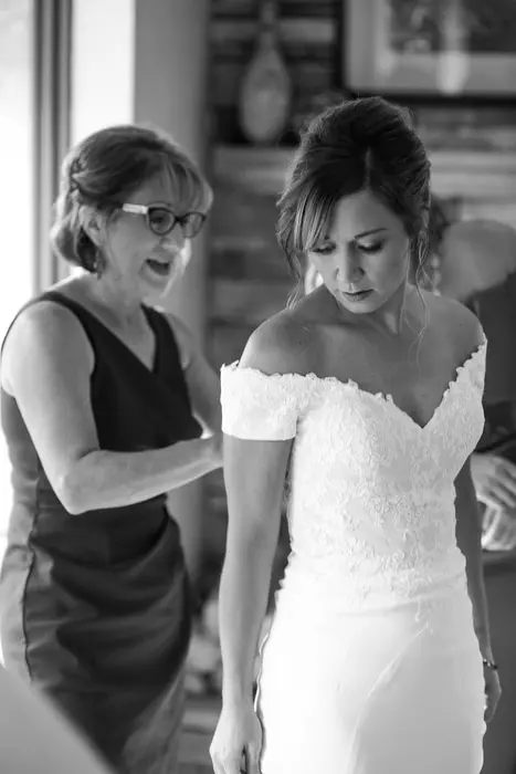 mom zips up daughter