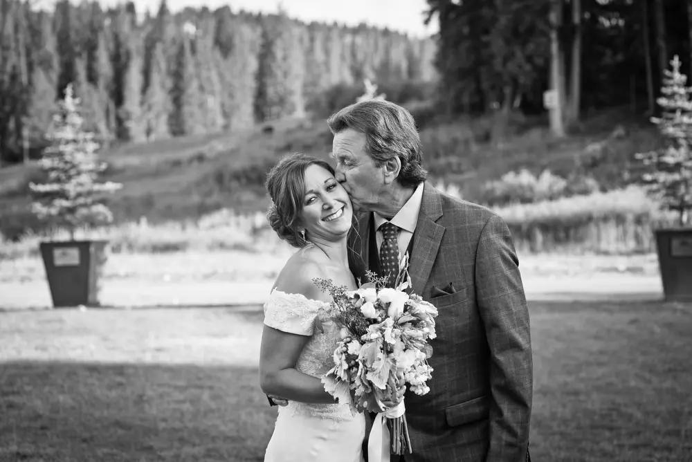 dad kisses daughter