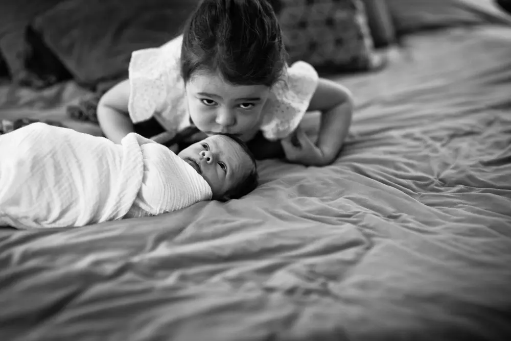 older sister with baby