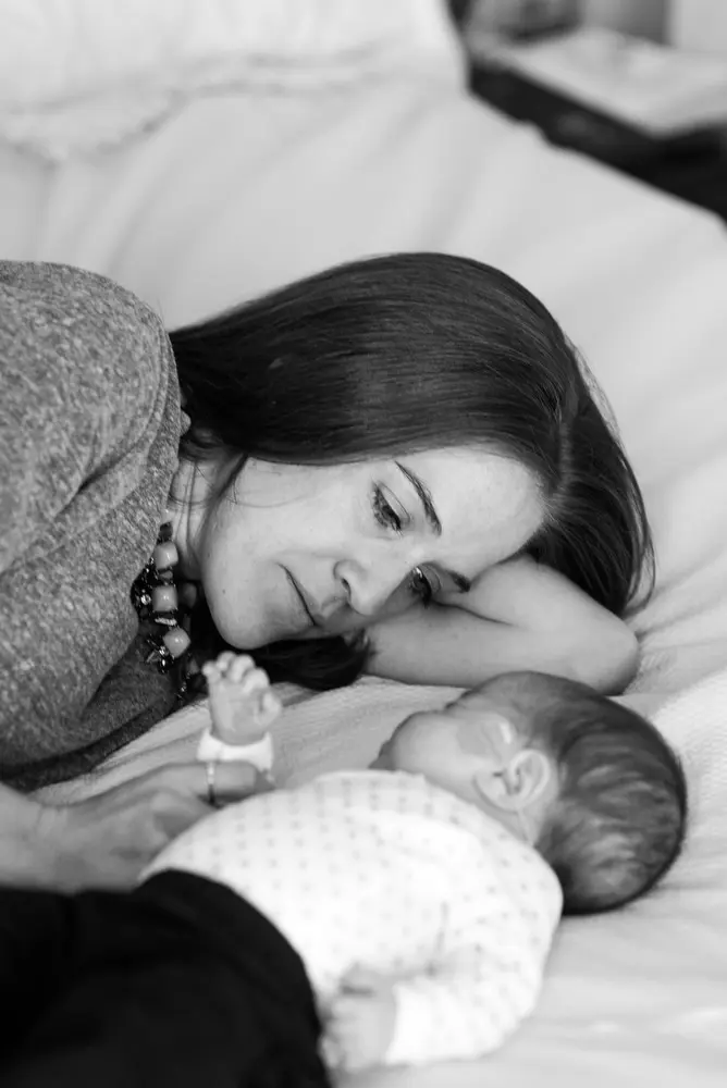 mom snuggles with baby