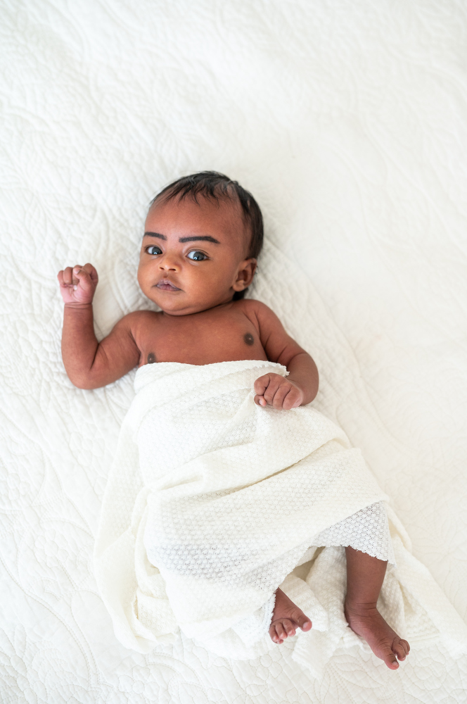 baby girl portrait on bed