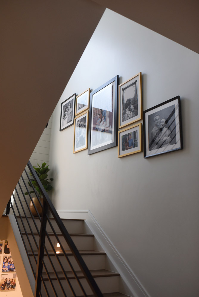 modern wall gallery with black and gold frames