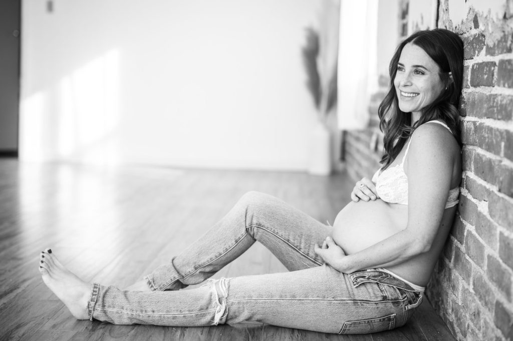 brick wall maternity portraits in Denver