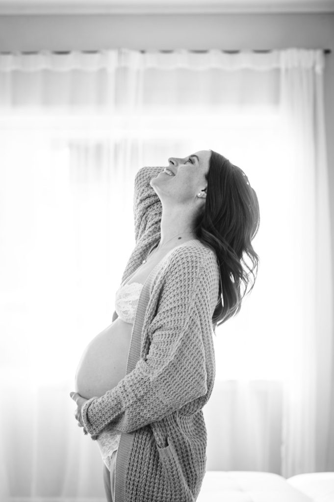 maternity portraits wearing a cardigan