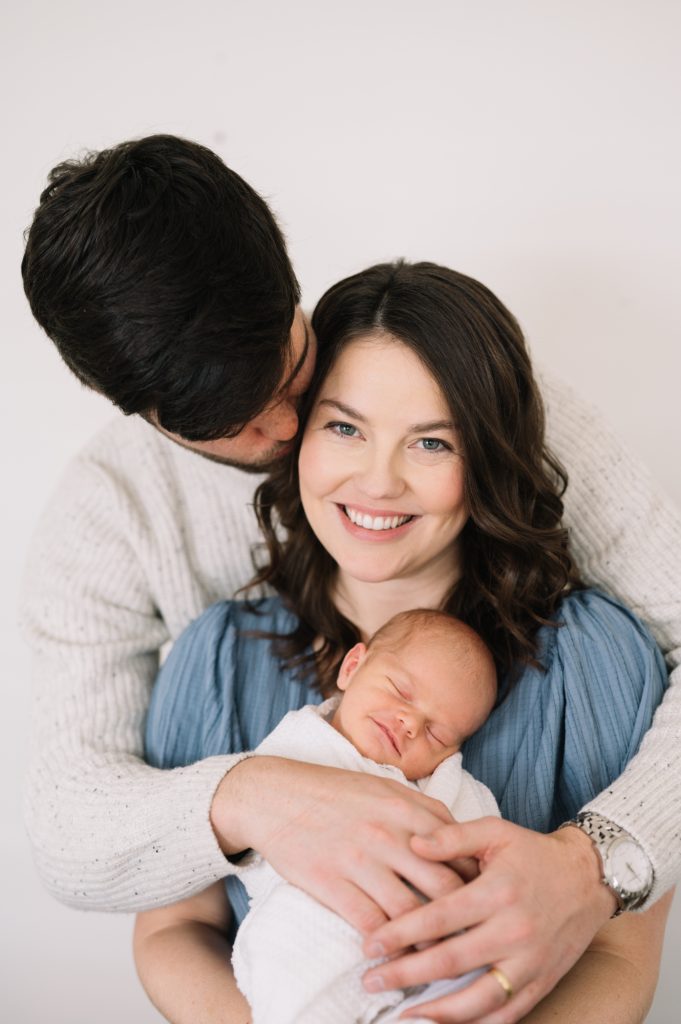 newborn baby smiling during portraits in Denver
