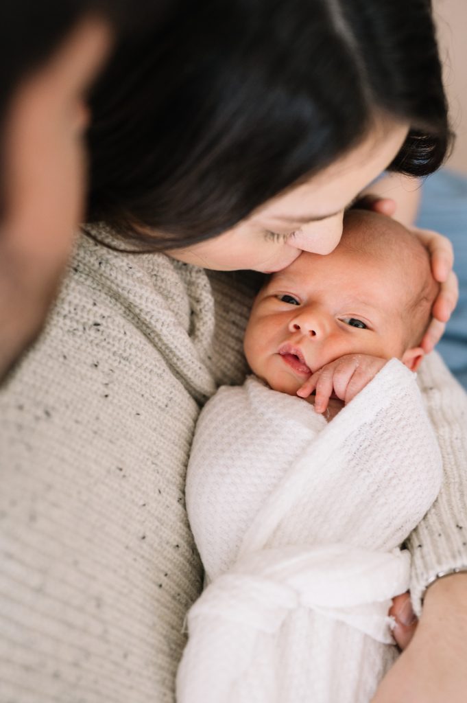 newborn baby in Denver stares at his mom