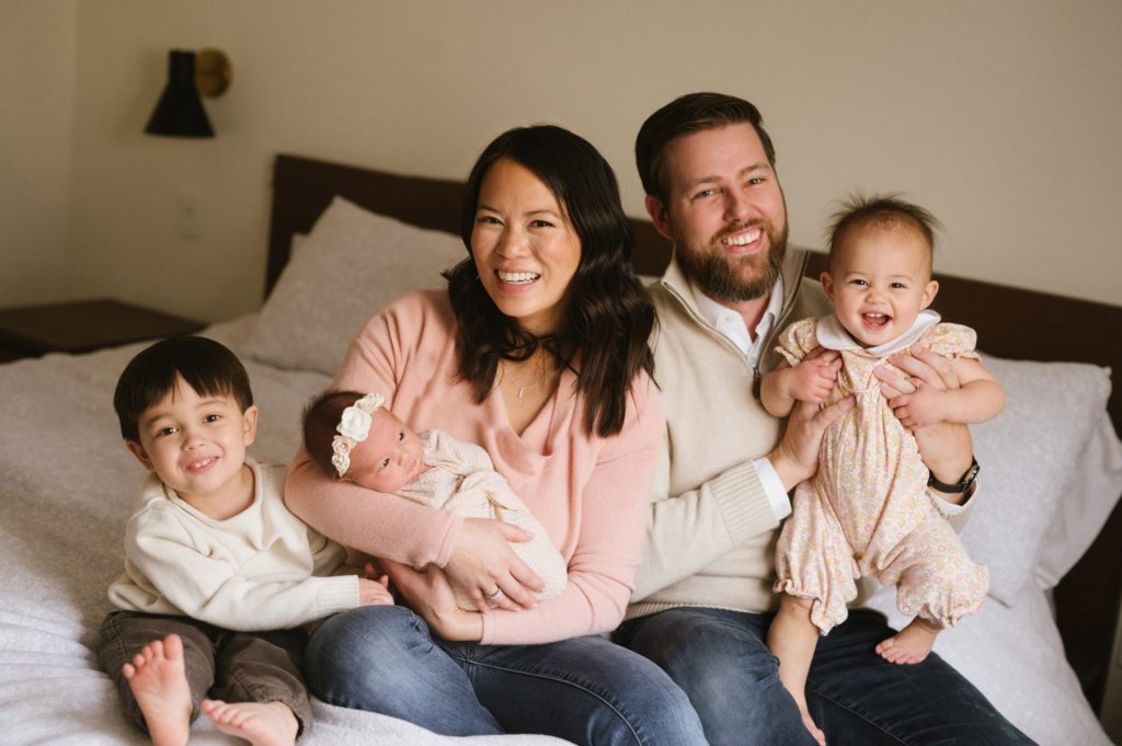 family photograph of three children with parents