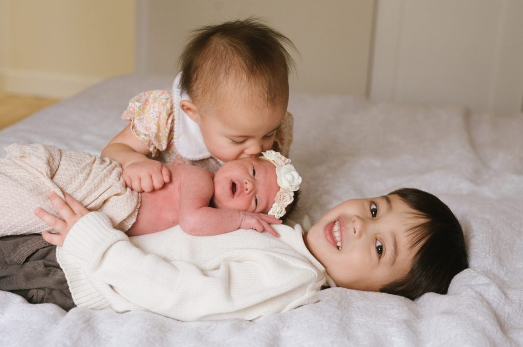 photo of three children under four years old.