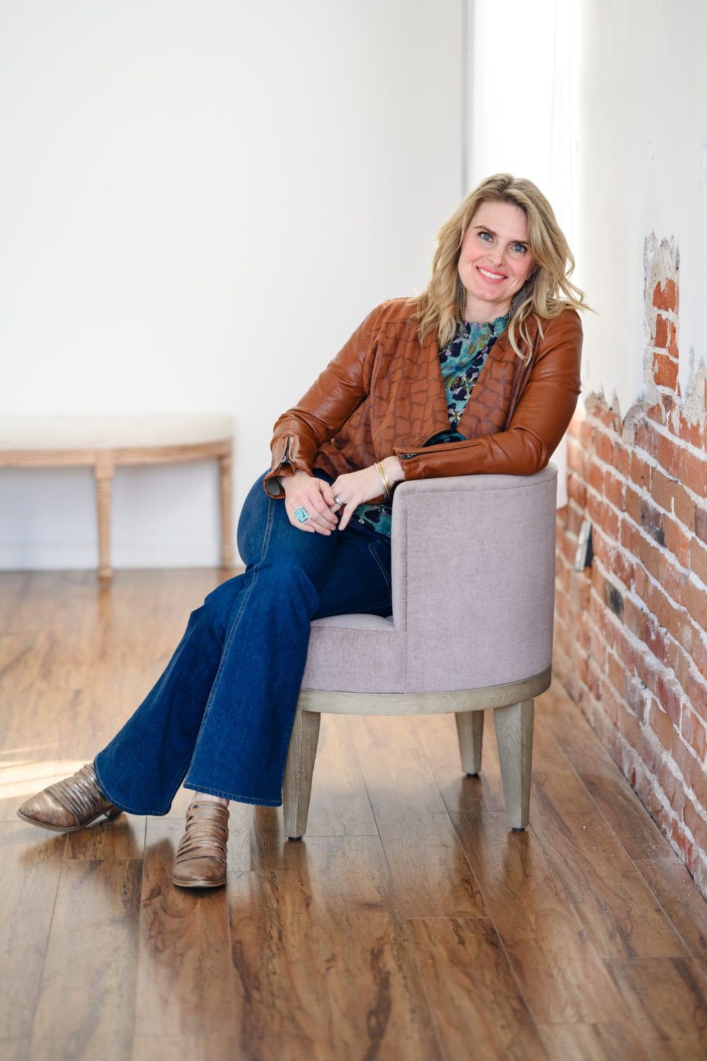 photographer sitting in a chair in her studio