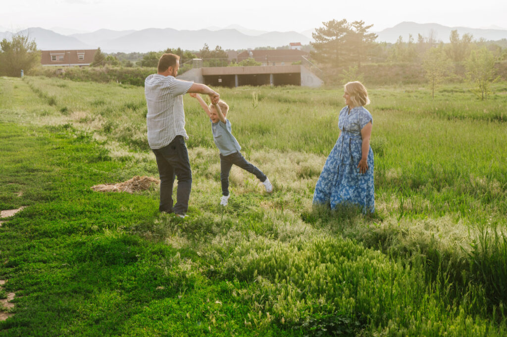 A family plays in the field in Littleton.