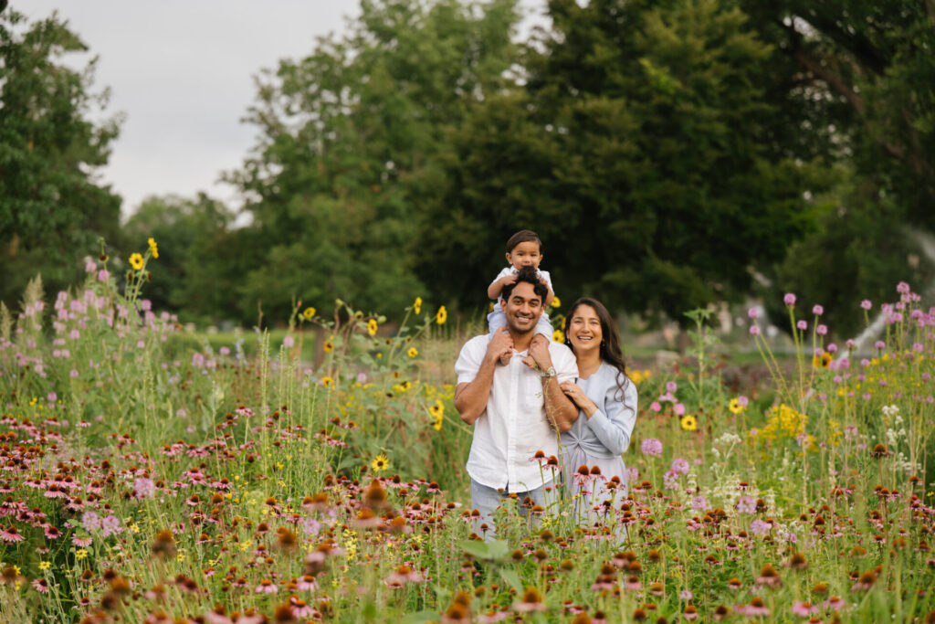 Parents pose in the garden at Wash Park