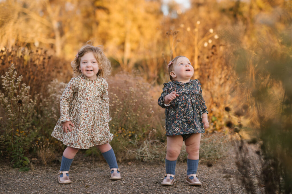 Sisters goof around during family pictures.